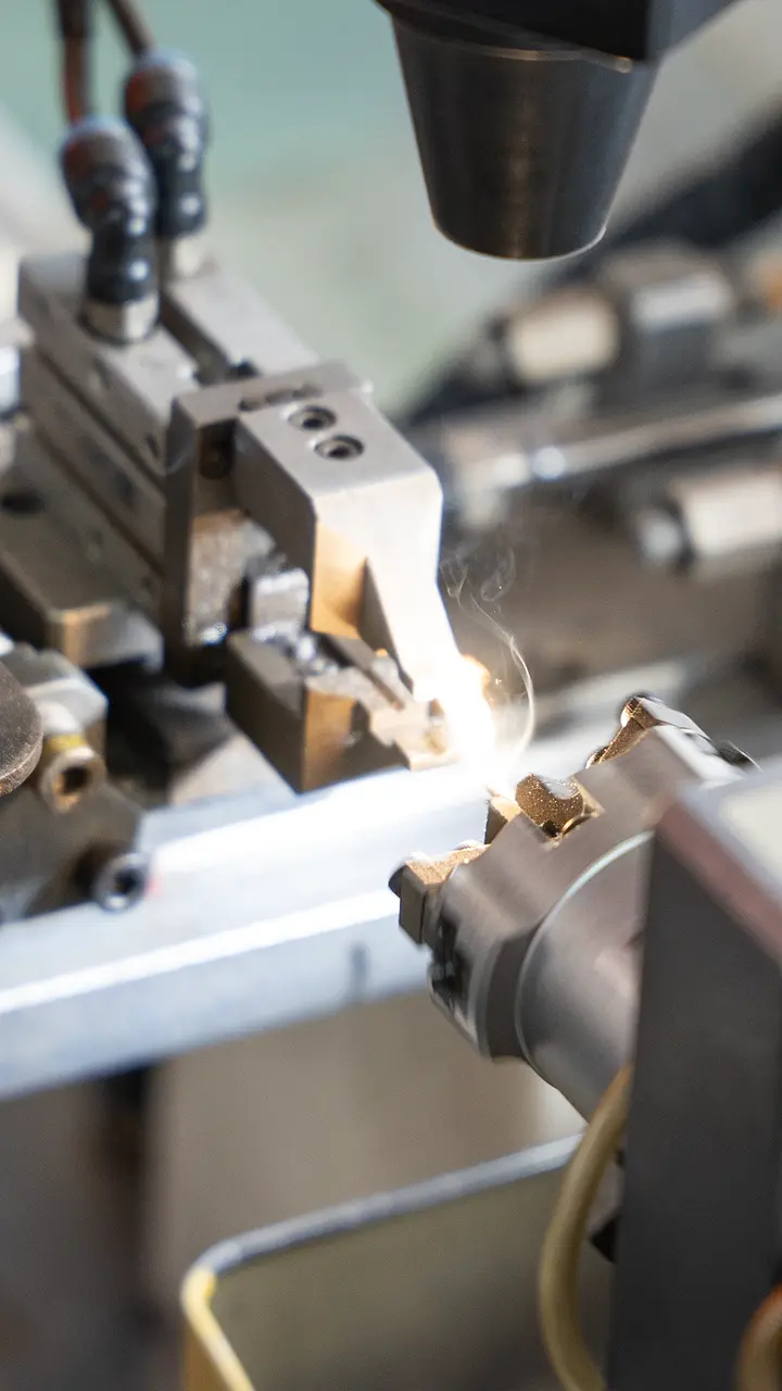 Automated spark plug electrode processing
